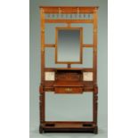 A Victorian walnut hall stand, with mirror, coat hooks and single drawer. Width 89 cm.