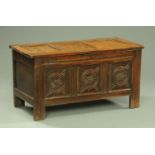 An 18th century oak coffer, three panelled,