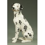 A large pottery figure of a seated Dalmatian. Height 67 cm.