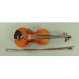 A full size violin, late 19th century, with purfling front and verso, with pronounced scroll,