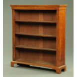 A Victorian mahogany open bookcase, with moulded edge, flat pilasters and plinth base.