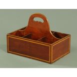 A 19th century mahogany and crossbanded six division bottle holder. Width 28.5 cm, height 22.