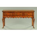 A George III style oak and mahogany crossbanded dresser base,