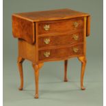 A walnut veneered Queen Anne style serpentine fronted chest of drawers,