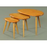 A nest of three Ercol light elm "pebble" tables (see illustration).