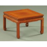 A Chinese square low occasional table. Width 51 cm.