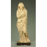 A large plaster figure of Mary, holding aloft a lamp. Height 140 cm.