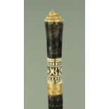 An Indian sword cane, with brass and bone handle. Length 90 cm.