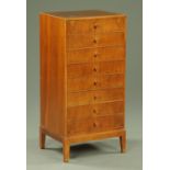 An Art Deco period walnut music cabinet with eight drop down drawers,