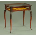 An Edwardian mahogany bijouterie table, with hinged top,