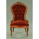 A Victorian walnut ladies chair, with exposed moulded show frame and serpentine seat,