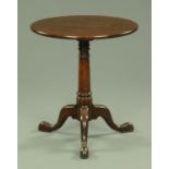 A George III oak tripod table, with fixed top,