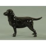 A Royal Doulton figure of a black Labrador, Model No. 2667. Length 18.5 cm.