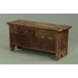 A 17th century oak six plank coffer, with carved front and silhouette ends, probably Welsh.