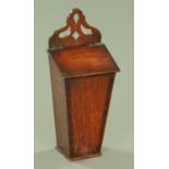 A George III oak and mahogany banded candle box, of typical form with pierced hanger.