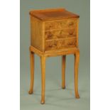 A walnut bedside cabinet,