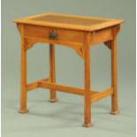 An Edwardian oak writing table,