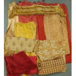 A vintage quilted bed cover, various curtains, pelmets and pieces of material (quantity).
