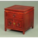 A Chinese wooden low table and combined cupboard,