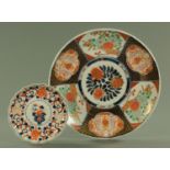 A 19th century Imari charger, diameter 40.5 cm, and scalloped edge plate, diameter 22 cm.