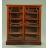 An Edwardian mahogany glazed bookcase,