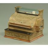 A 19th century National Cash Register Company brass till, of fairly large form, bearing plaque,