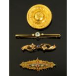 Two 15 ct gold brooches, an Edwardian 9 ct gold brooch and a Victorian 9 ct gold brooch,