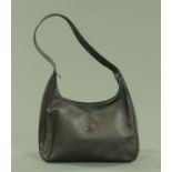 A Longchamp ladies leather shoulder bag, 32 cm wide, 31 cm to base of strap.