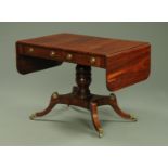 A Regency rosewood single pedestal sofa table, early 19th century, having a well figured top,