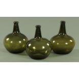Three 18th century style olive green wine bottles,