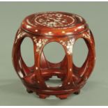 A Chinese hardwood and mother of pearl inlaid drum form vase stand,