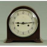 An Enfield Bakelite mantle clock, early 20th century, with eight day movement chiming on a gong,