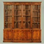 A Reprodux mahogany breakfront bookcase, in the Georgian style,