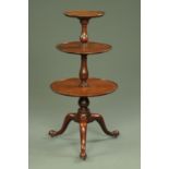 A George III mahogany three tier circular dumbwaiter, small proportions,