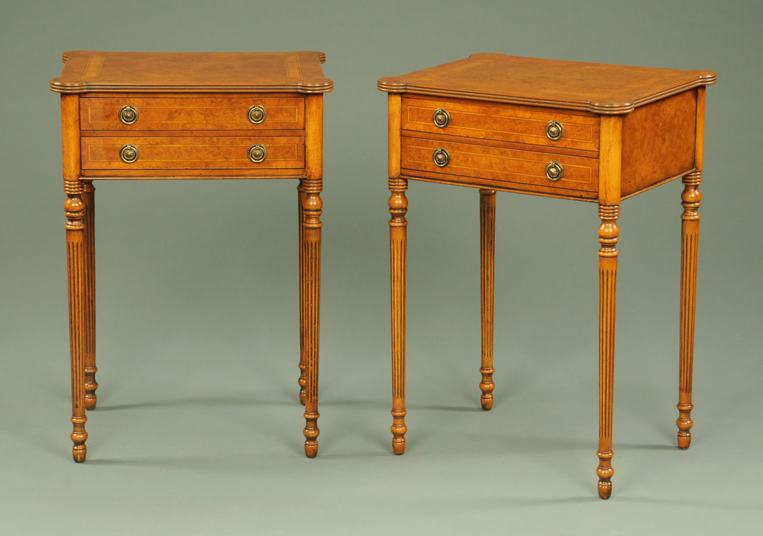 A pair of walnut veneered side tables, 20th century,
