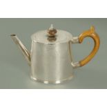 A George III silver teapot, Charles Wright, London 1773, of circular drum form,