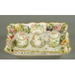 A Meissen style porcelain ink stand, with two inkwells and a floral fruit encrusted spill vase,