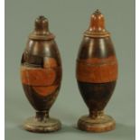 A pair of 18th century Lignum Vitae coffee grinders, with bell shaped tops and on circular feet.