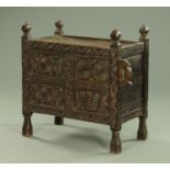 An Indian carved wood Swat chest, 19th century, with carved decoration with single drawer panel,