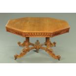 A large Victorian oak hall table, octagonal, with moulded edge and carved frieze,