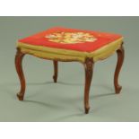 A Victorian walnut square stool, with floral tapestry top,