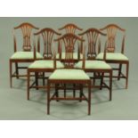 A set of six mahogany dining chairs, with pierced splat backs,