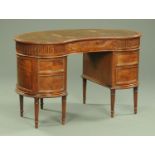 An Edwardian mahogany kidney shape desk,