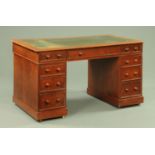 A Victorian mahogany pedestal desk, with green tooled leather writing surface,