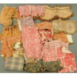 A large quantity of vintage fabric pelmets, many with printed designs,