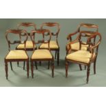 A set of two carver arm and four single Victorian mahogany dining chairs,