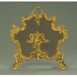 A cast metal spark guard, in the Rococo style,