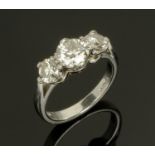 WITHDRAWN - A platinum set three stone diamond ring, the central stone diameter +/- 5 mm,