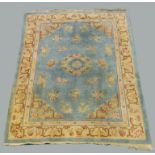 A Chinese floral patterned rug,