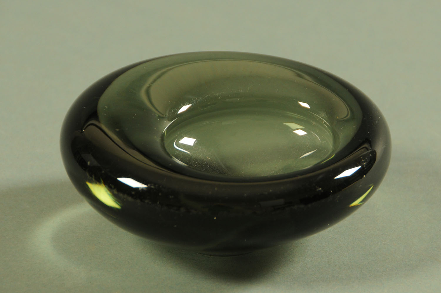 Per Lutken for Holmegaard, an "Akva" glass vase in smoky green, circa 1960's, 13 cm diameter.